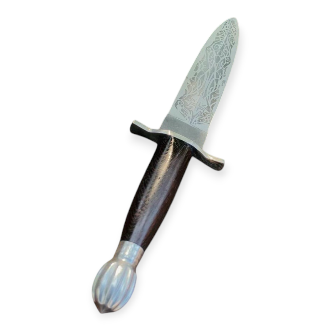 Decorative dagger with a detailed blade on a white background