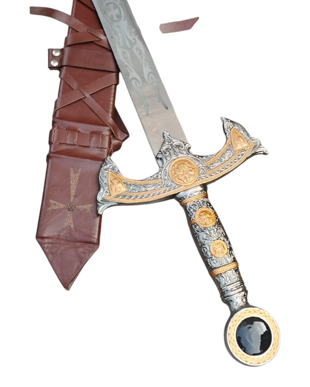 Decorative sword with ornate handle and sheath on a white background