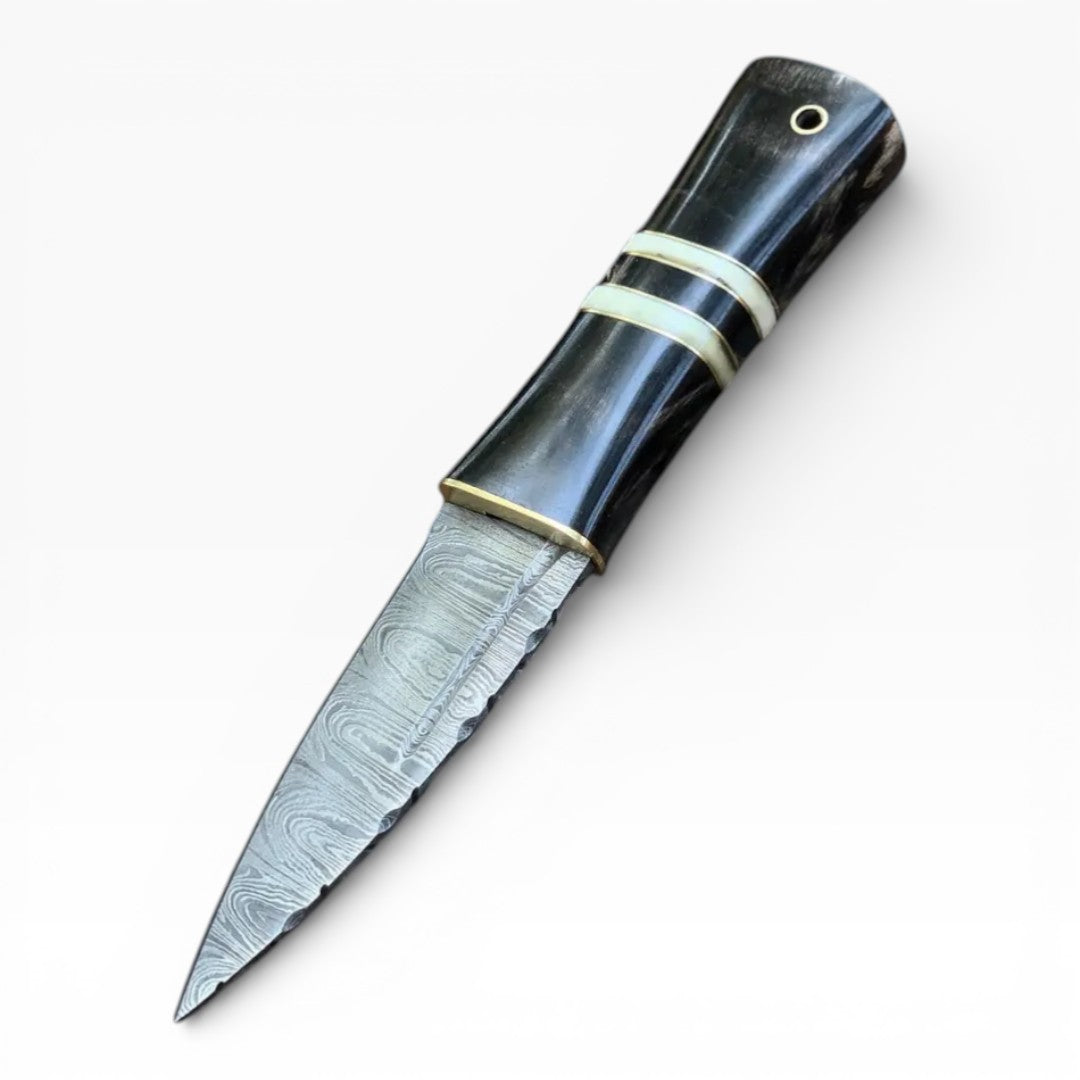 Decorative knife with a black handle and silver blade on a white background