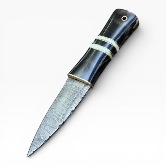 Decorative knife with a black handle and silver blade on a white background