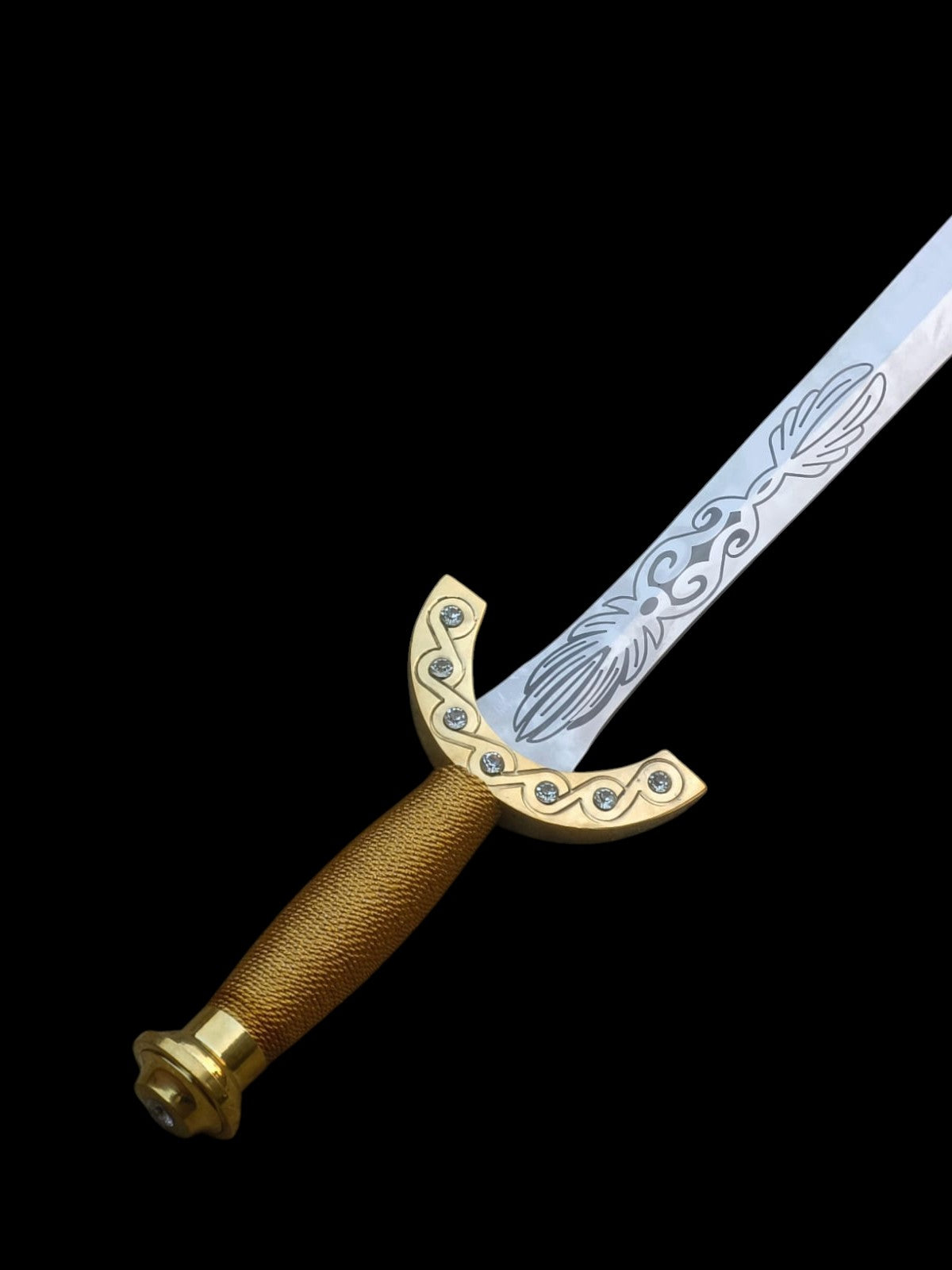 Decorative sword with gold handle and blue blade on a black background