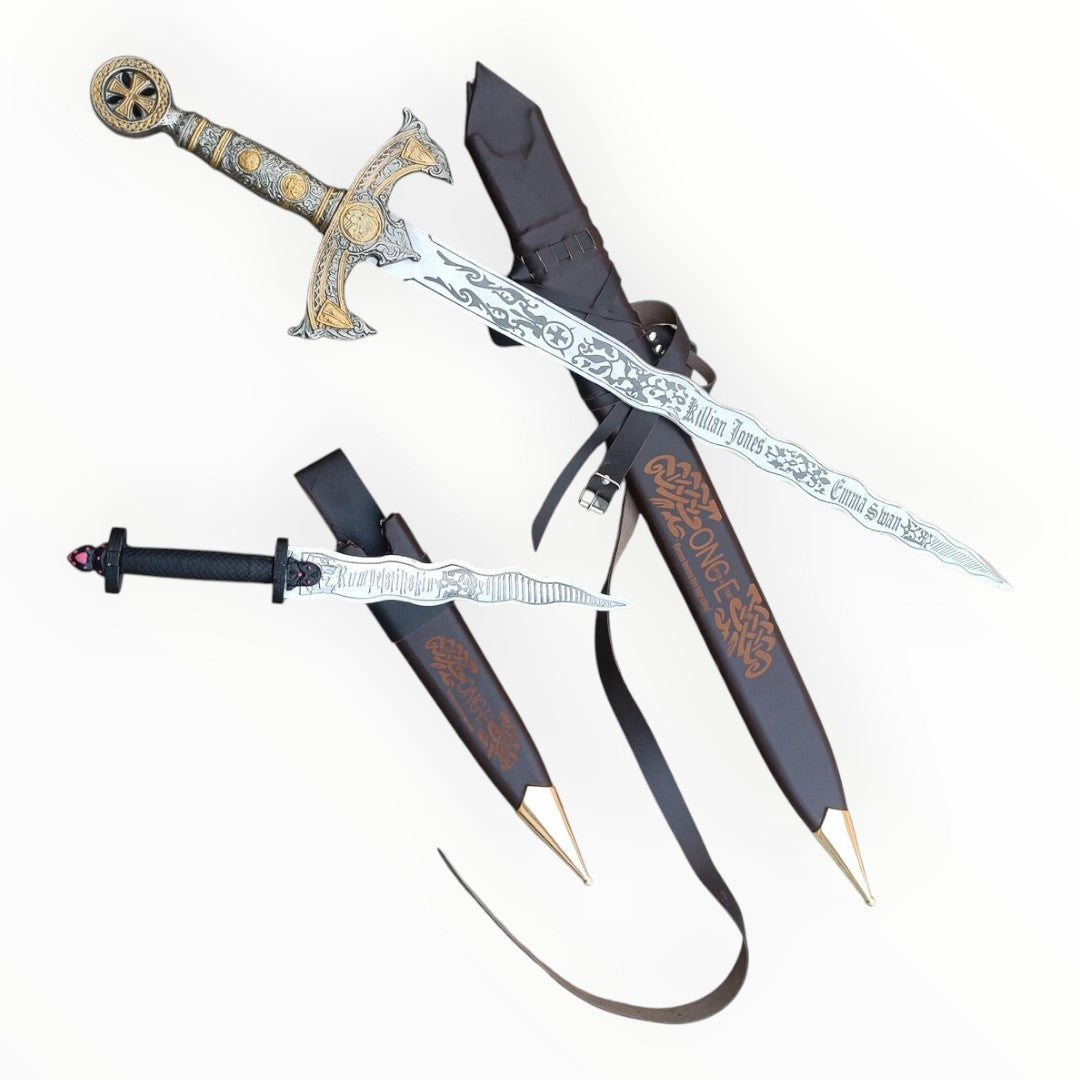 Decorative swords with ornate handles and sheaths on a white background