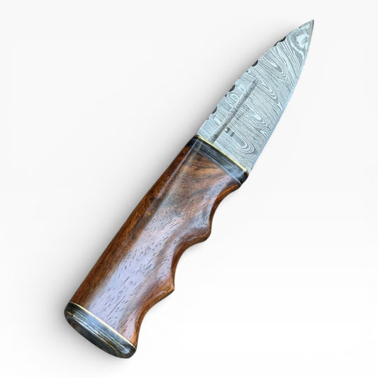 Knife with wooden handle and Damascus steel blade on a white background