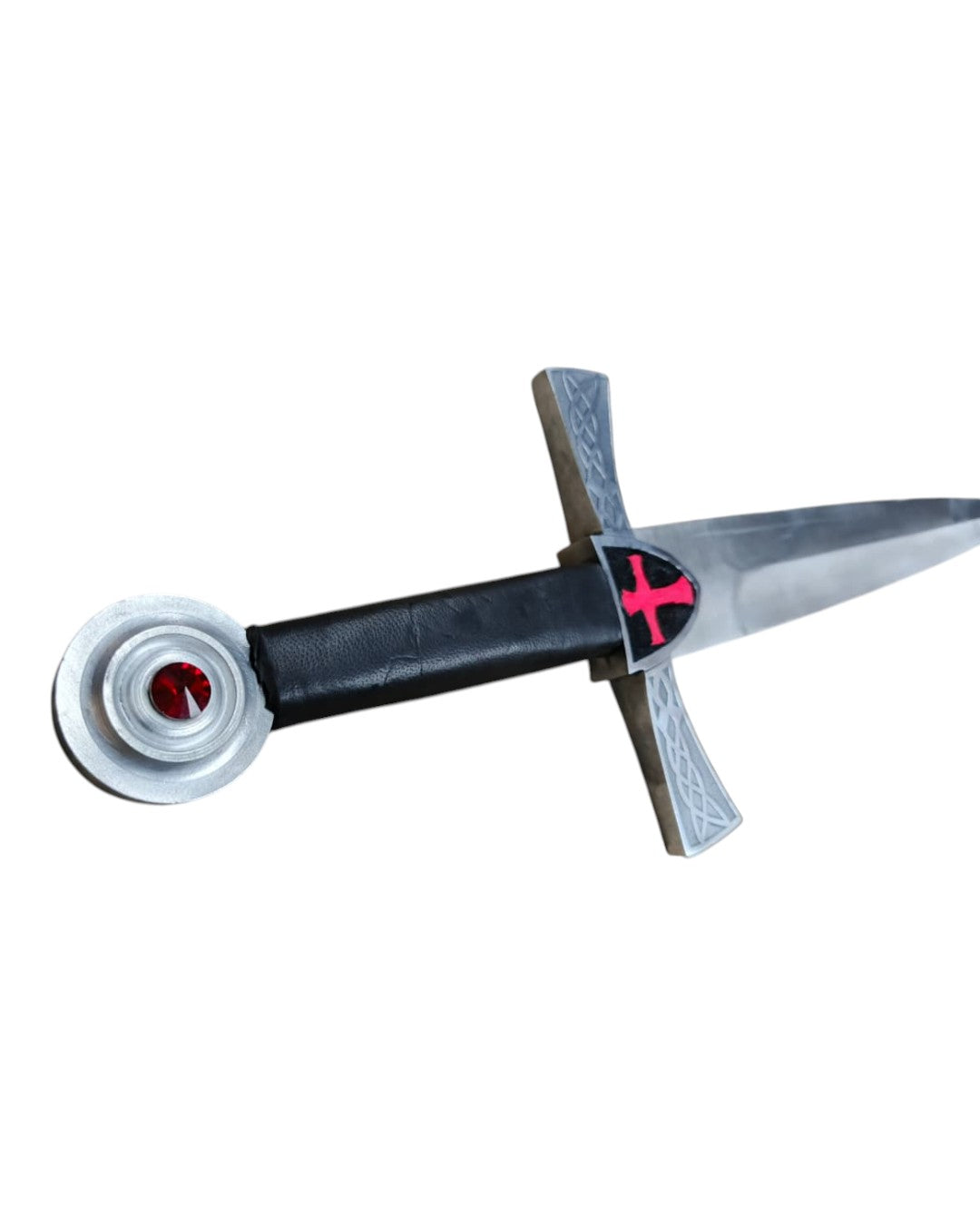 Sword with a black handle and red emblem on a white background